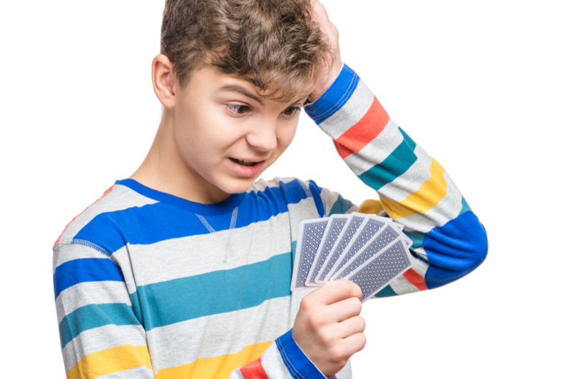 Boy with playing cards