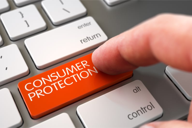 Finger touching CONSUMER PROTECTION key