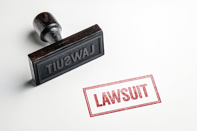 Rubber stamp saying LAWSUIT