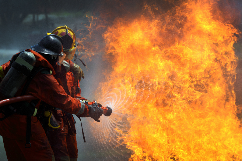 firefighters extinguishing a fire