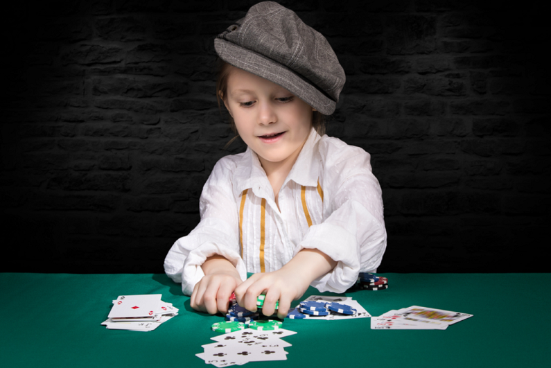 female child playing poker