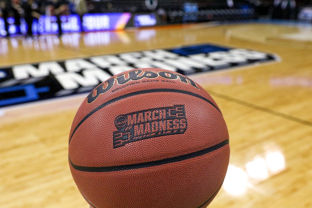 March Madness basketball on a basketball court