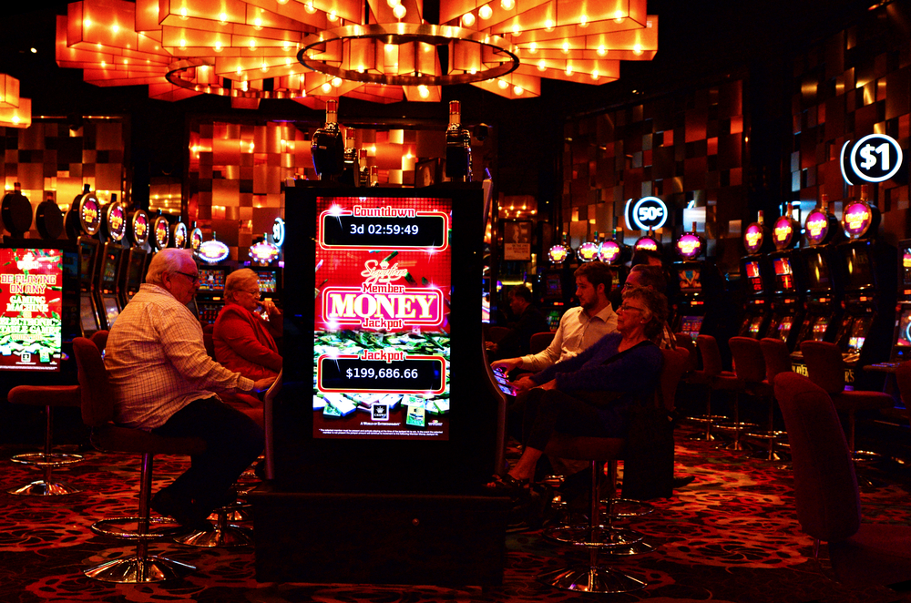 patrons playing at games machines at Crown Casino Melbourne