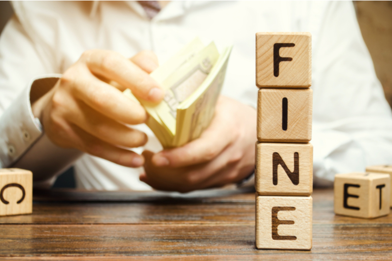 Man with cash next to fine bricks