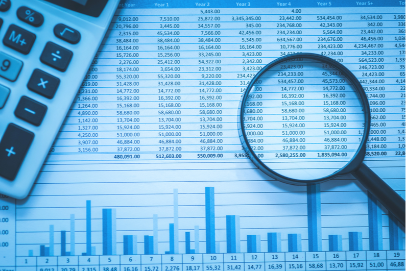 magnifying glass on a spreadsheet