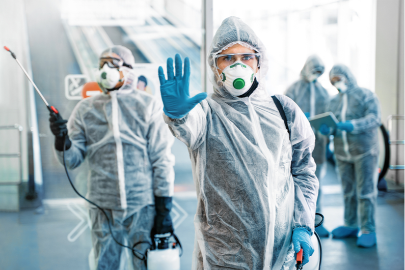 Health officials in protective suits